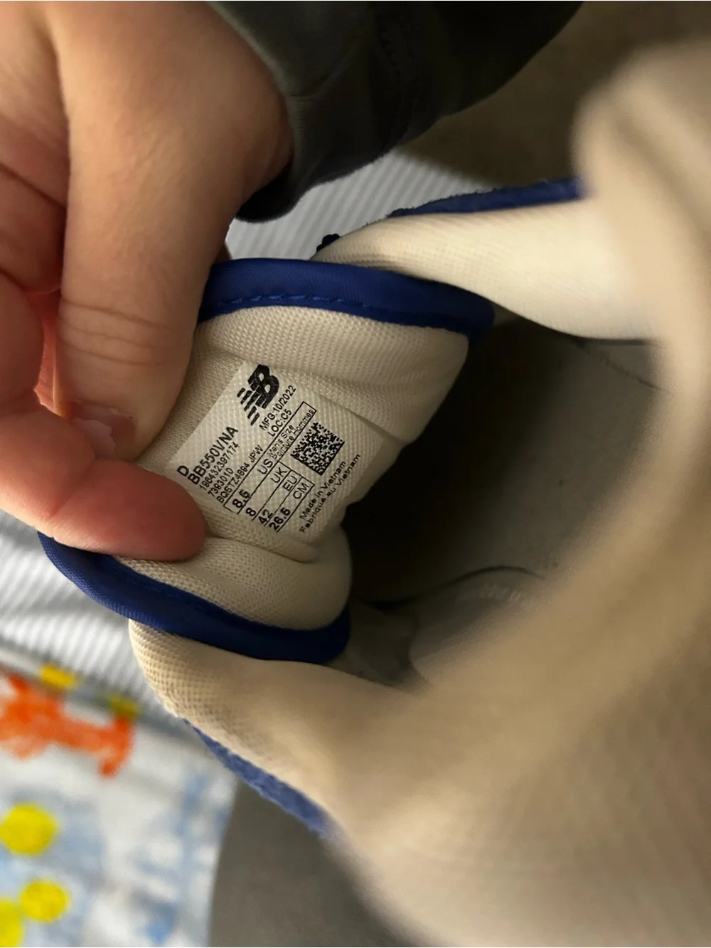 New Balance white sneaker with blue trim